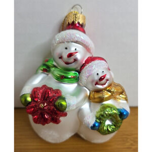 Snowmen holding Red Poinsettia/Green Wreath Christmas Hand Blown Glass Ornament